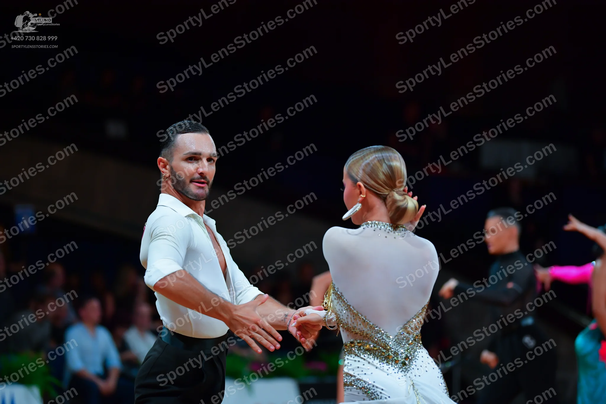 Dancesport competitor: Male dancer: white long-sleeved shirt and black trousers