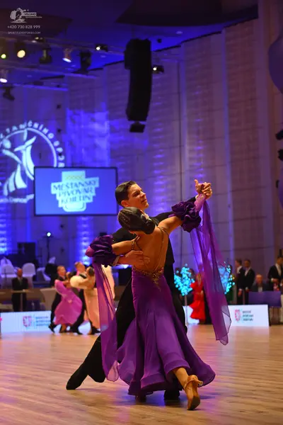 Dancesport competitor: Male dancer: black ballroom suit