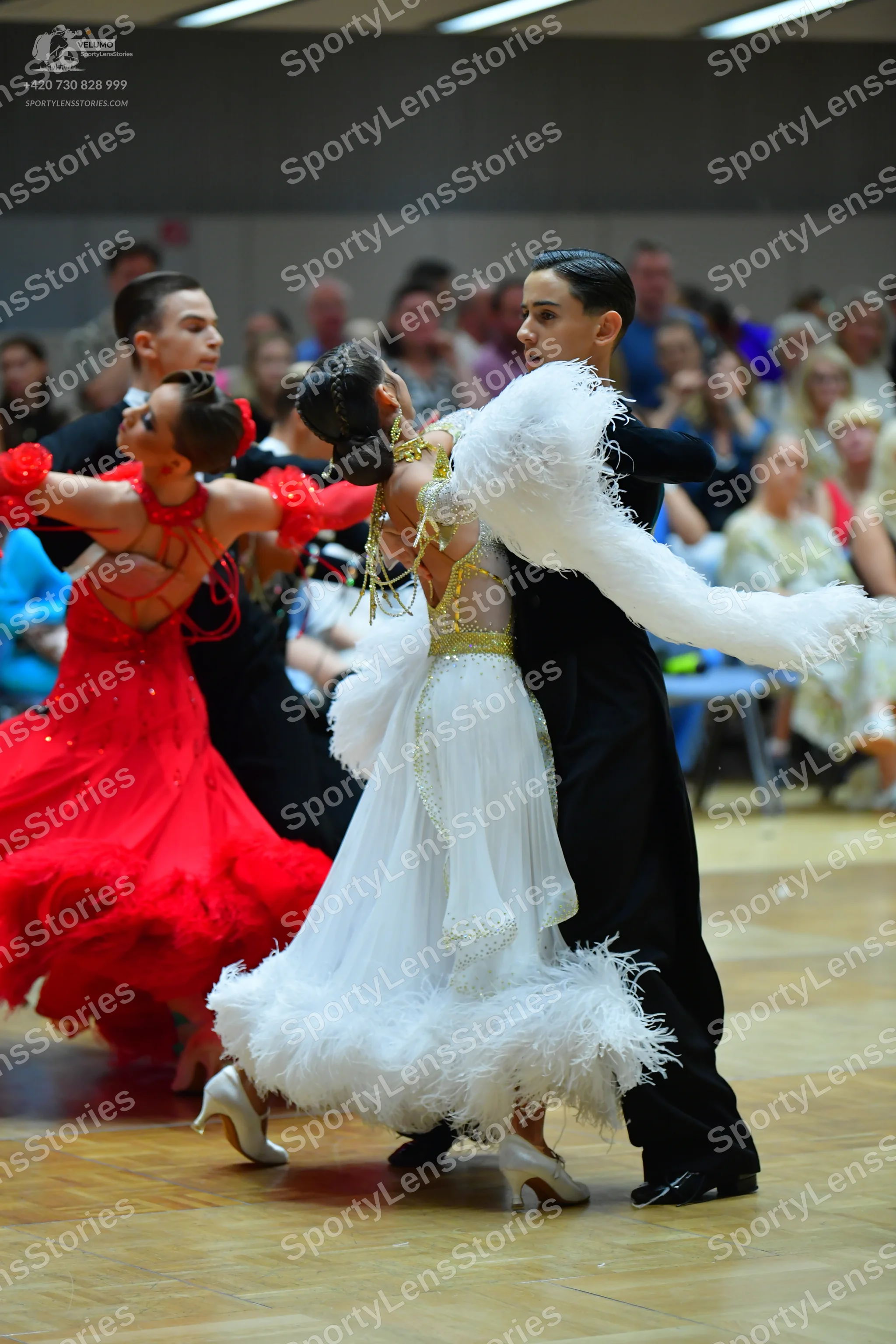Dancesport competitor: Female dancer 1: red latin dress with ruffles