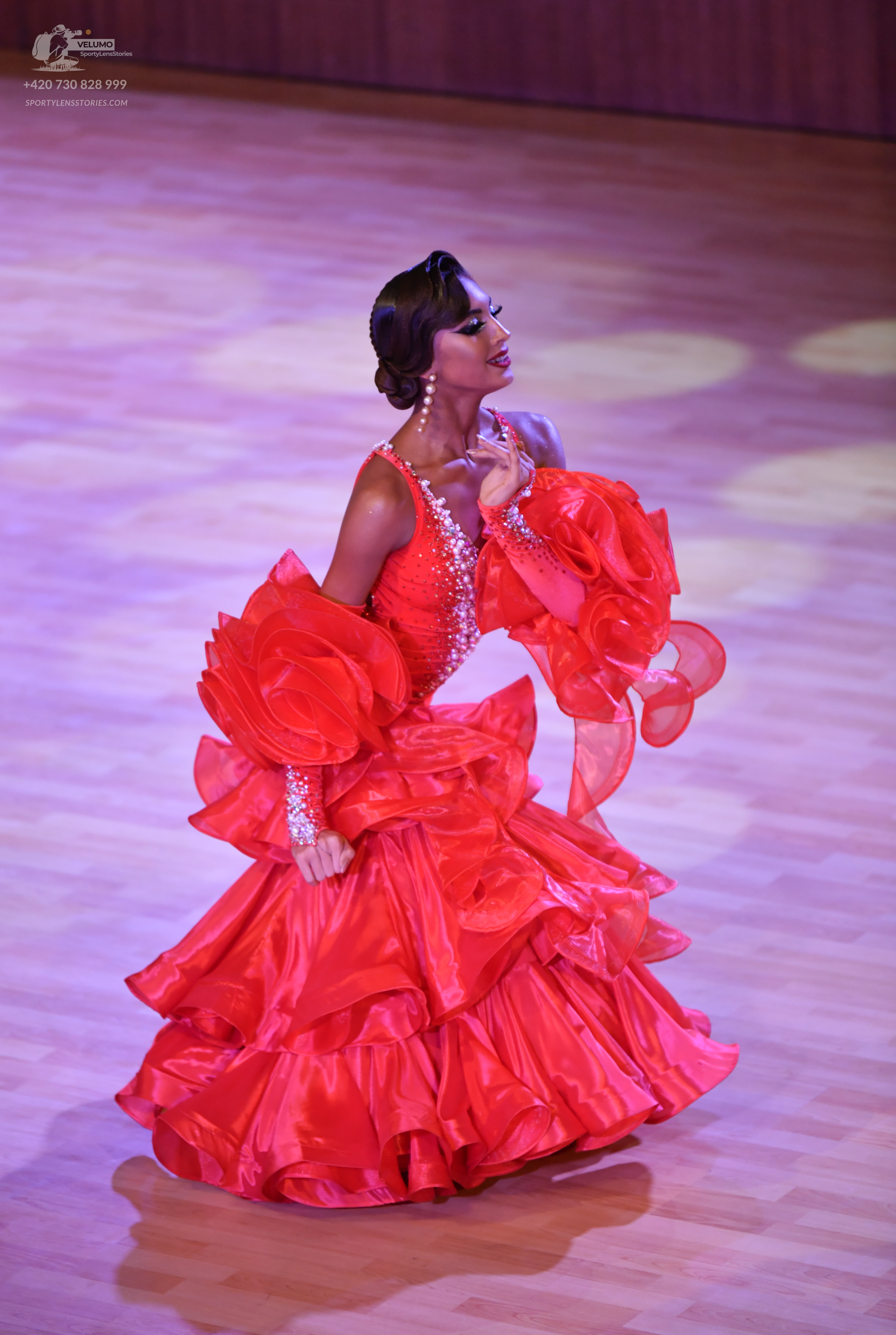 Dancesport competitor: Female:** Red Latin Dress