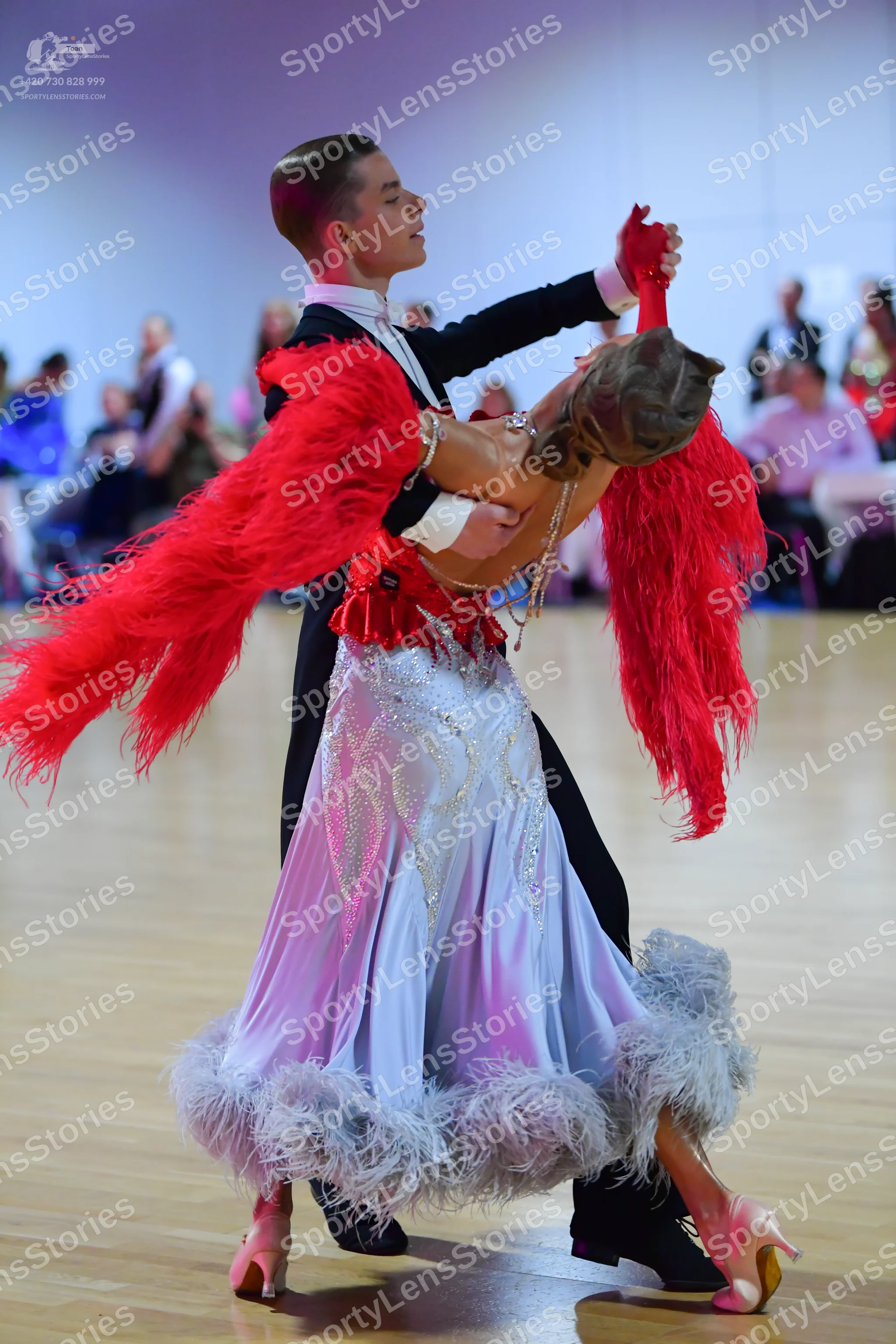 Dancesport competitor: Male dancer: black suit with a white shirt and black bowtie