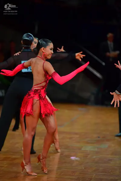 Dancesport competitor: Male dancer: black long-sleeved shirt and black trousers