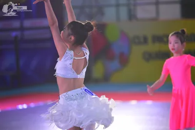 Dancesport competitor: ** White latin dress