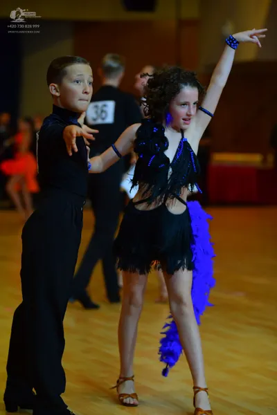 Dancesport competitor #36: Male dancer: black long-sleeved shirt and black trousers