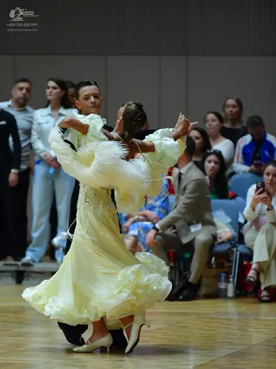 Dancesport competitor: Male dancer: black suit