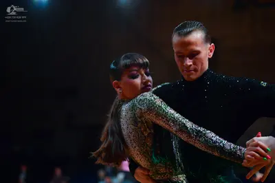 Dancesport competitor: Male dancer: black long-sleeved turtleneck