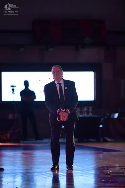 Dancesport competitor: ** Male: Black suit with a white shirt, tie, and black shoes