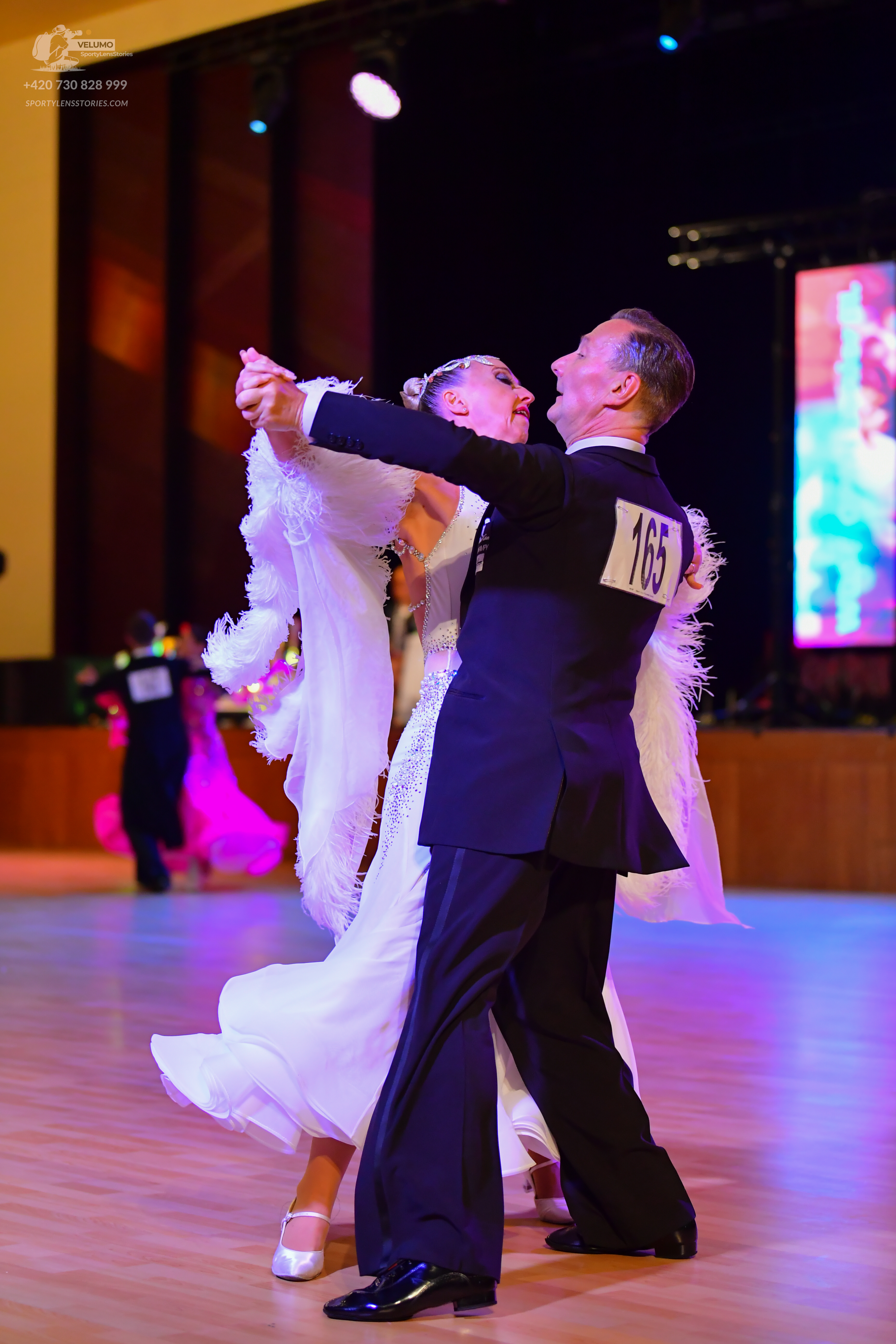 Dancesport competitor #4420: Male:** Black tailsuit with sequin lapels and a white shirt