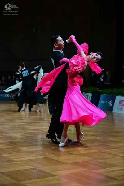 Dancesport competitor #113: Male dancer: black suit with a white shirt