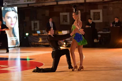 Dancesport competitor: Male dancer: black long-sleeve shirt and black trousers