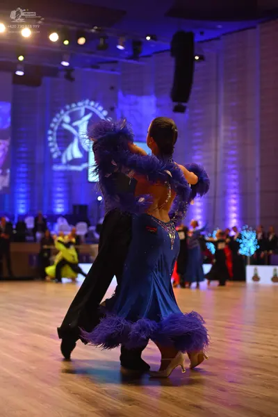 Dancesport competitor: Male dancer: black suit