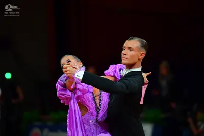 Dancesport competitor: Male dancer: black suit