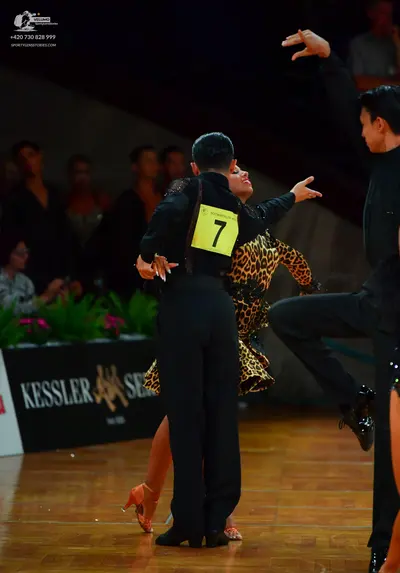 Dancesport competitor: Male dancer: black long-sleeved shirt and black trousers