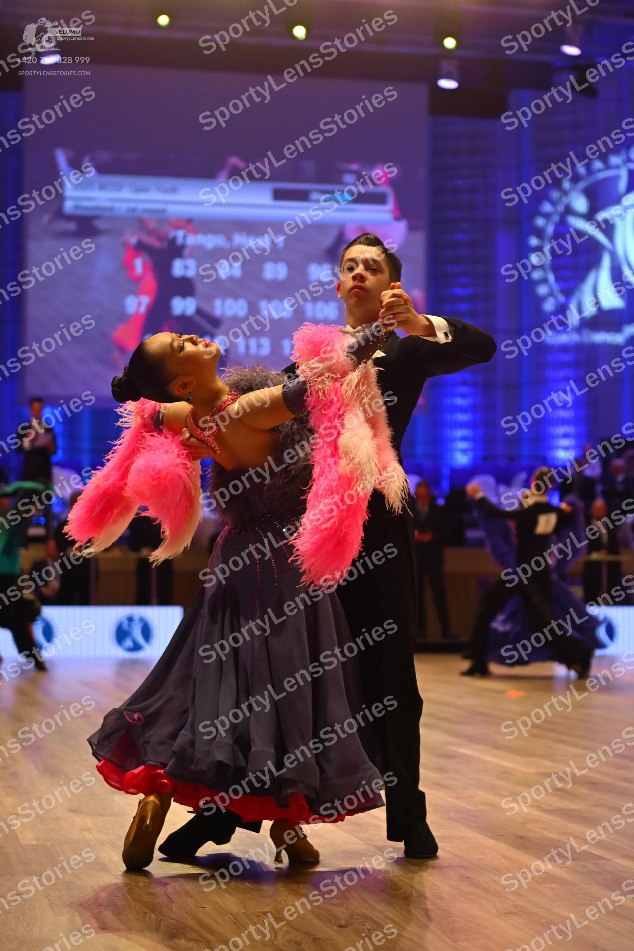 Dancesport competitor: Male dancer: black suit with a white shirt and black bow tie
