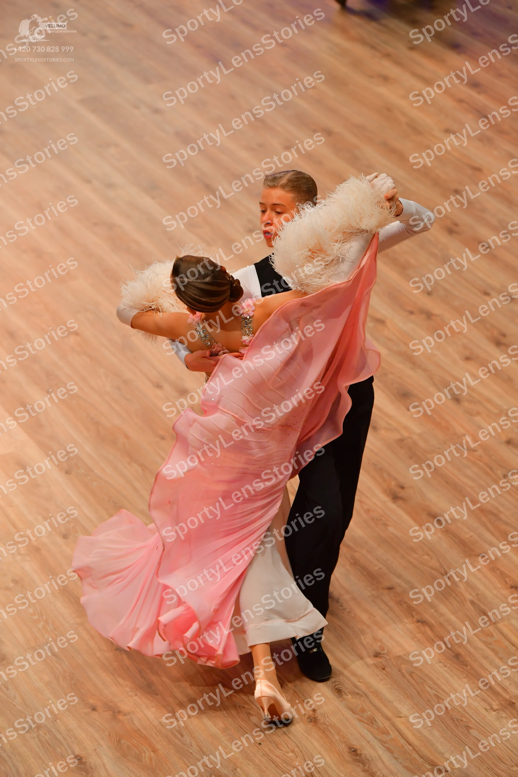 Dancesport competitor: Male dancer: white long-sleeved shirt and black trousers
