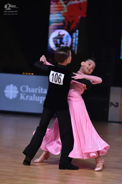 Dancesport competitor: Male dancer: black long-sleeved top and black trousers