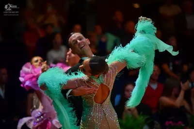 Dancesport competitor: Main female dancer: mint green Latin dance dress heavily embellished with sequin