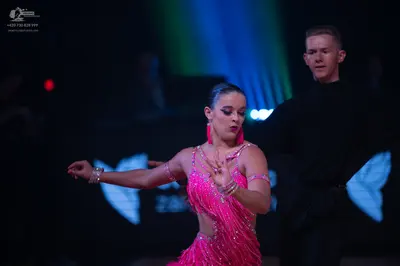 Dancesport competitor: Male dancer: black long-sleeved shirt and black trousers