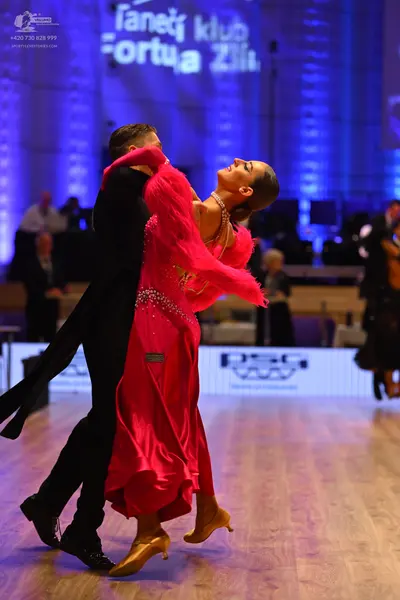 Dancesport competitor: Male dancer: black suit and black trousers