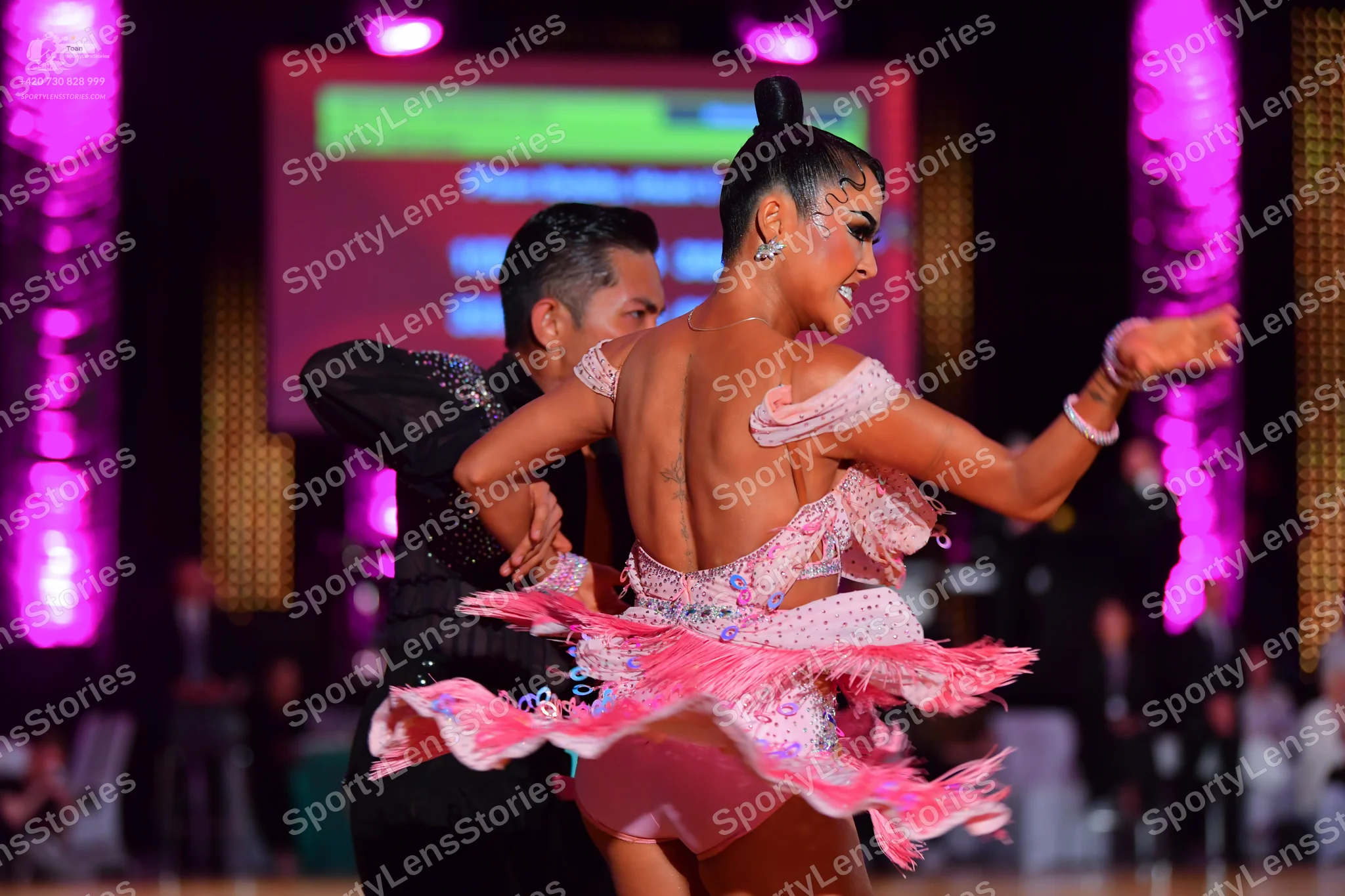 Dancesport competitor: Male dancer: black dance shirt with shimmering embellishments on the shoulder