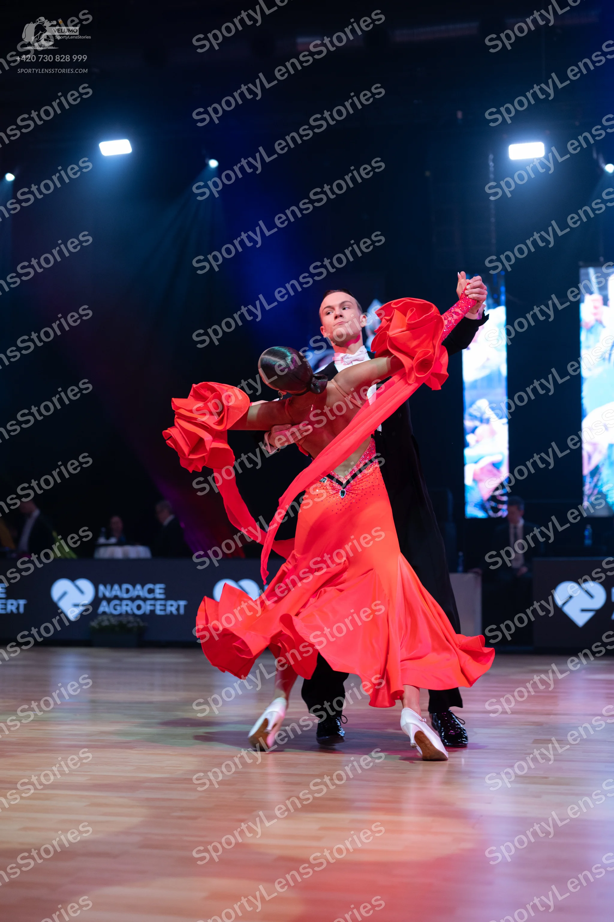 Dancesport competitor: Male dancer: black suit with a white shirt and bow tie