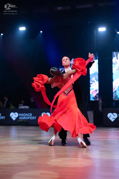 Dancesport competitor: Male dancer: black suit with a white shirt and bow tie