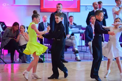 Dancesport competitor: Female dancer 1: yellow latin dress