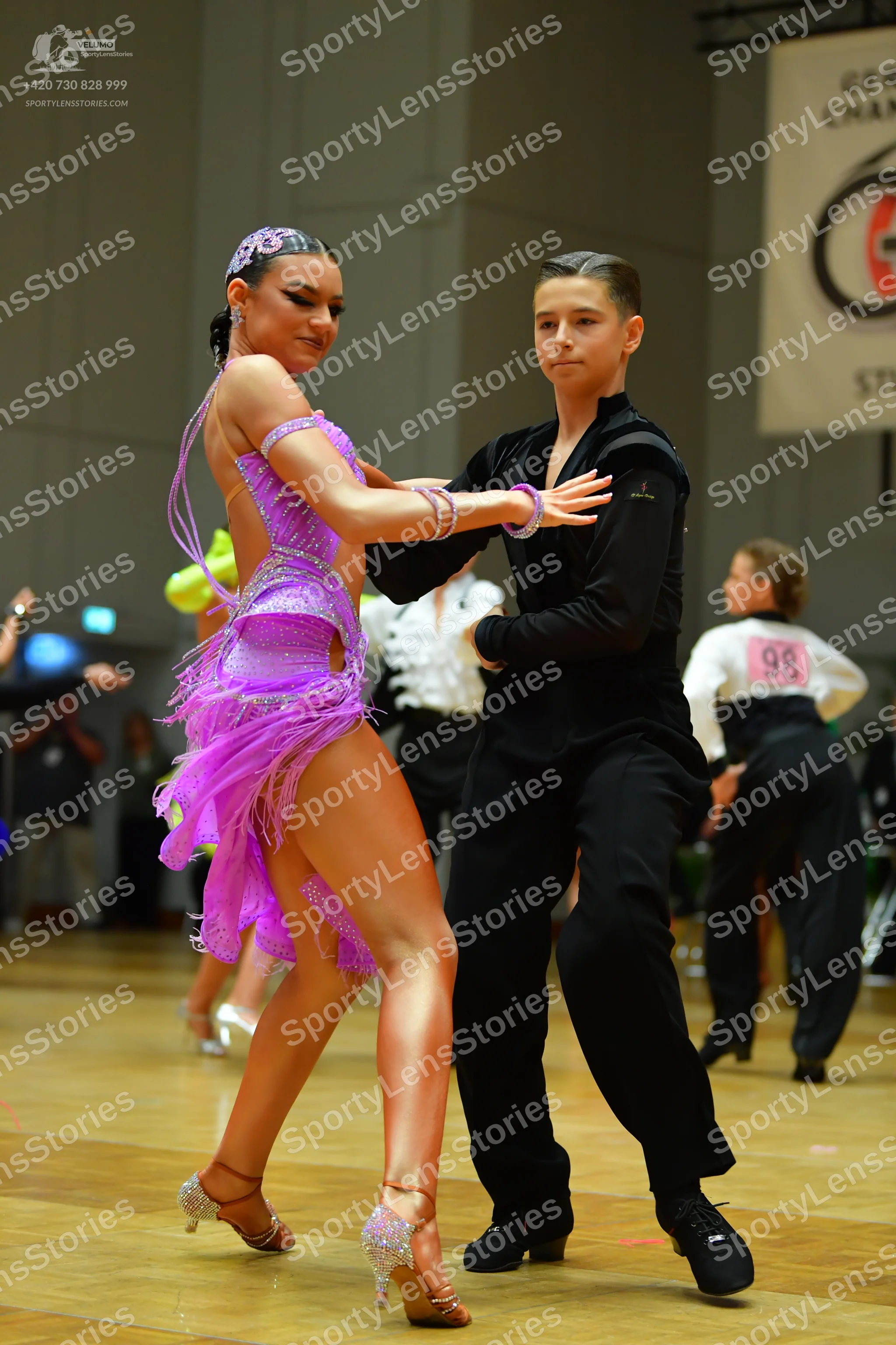 Dancesport competitor #98: Female dancer: purple latin dress with sequins and fringe