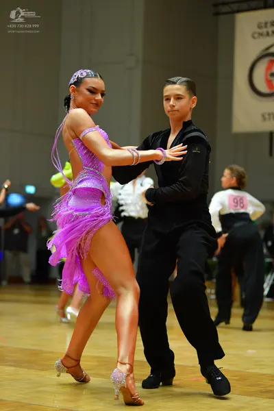 Dancesport competitor #98: Female dancer: purple latin dress with sequins and fringe