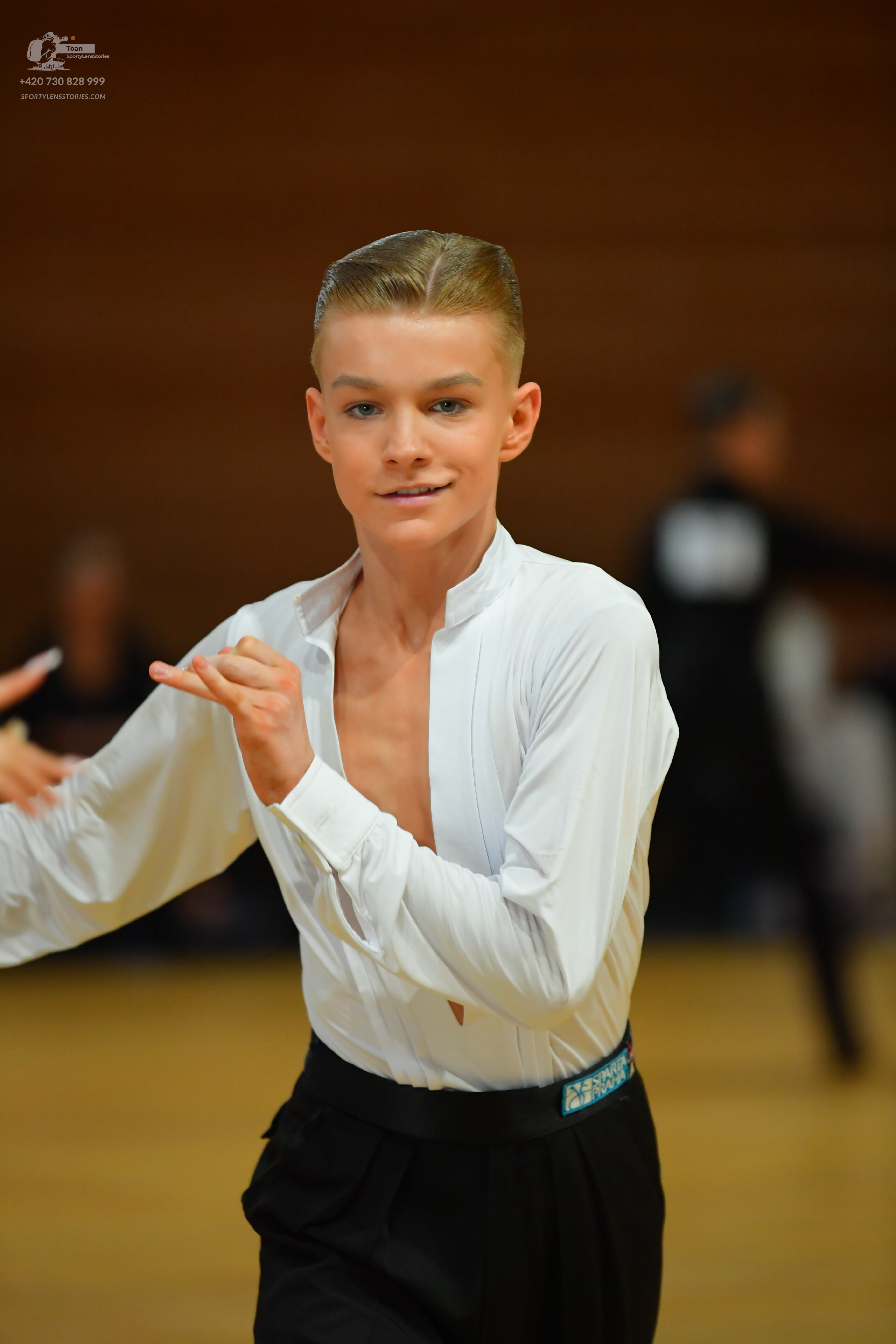 Dancesport competitor: ** White (off-white) tail suit with a wide, slightly flared lapel