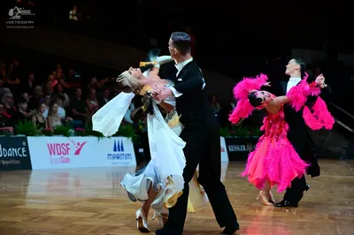 Dancesport competitor: Male dancer 1: black suit with a white shirt