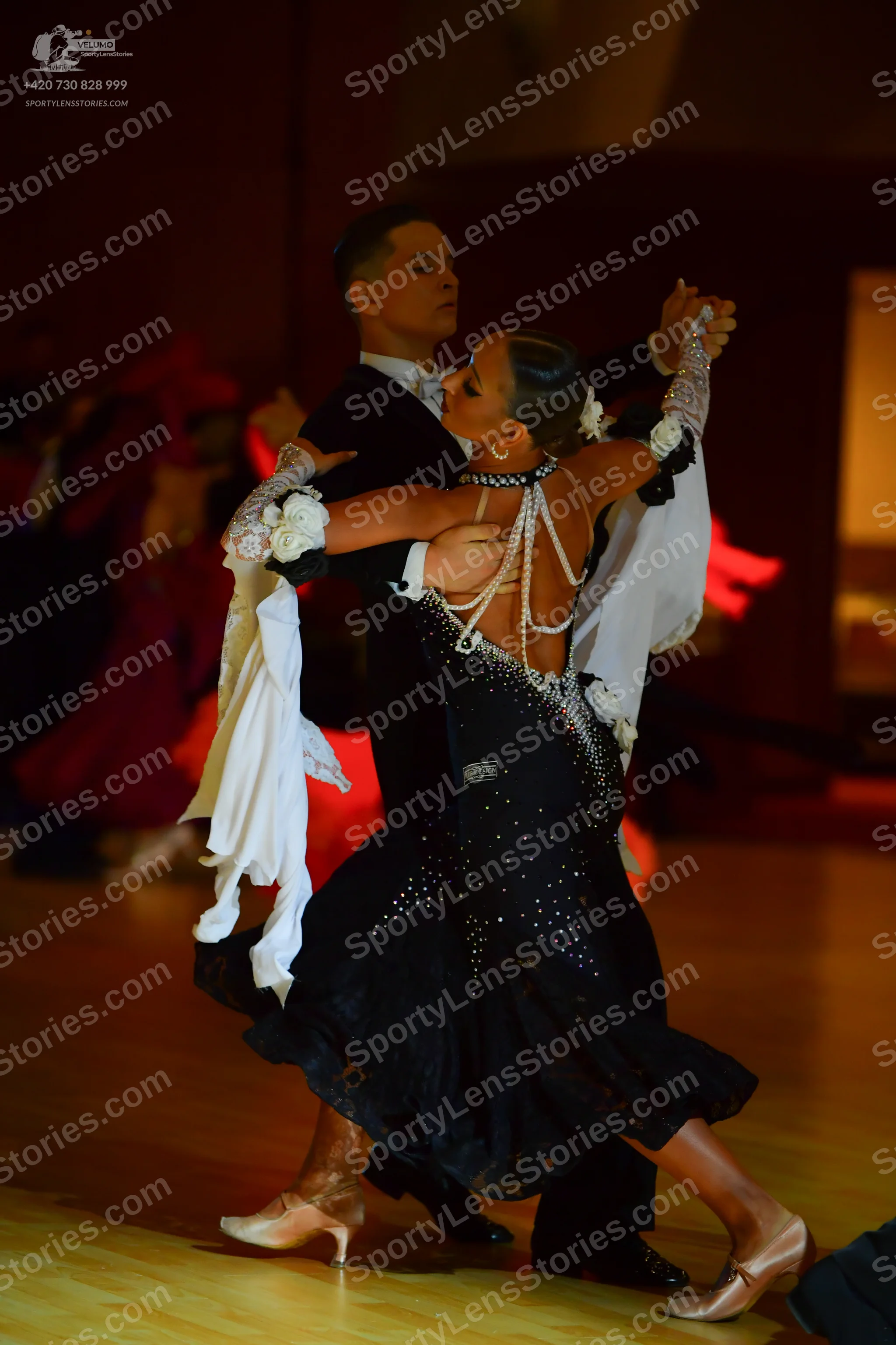 Dancesport competitor: Male dancer: black suit jacket with a white shirt