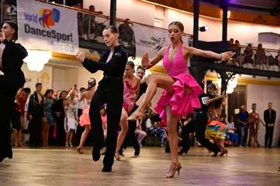 Dancesport competitor: Male dancer: black long-sleeve shirt and black trousers