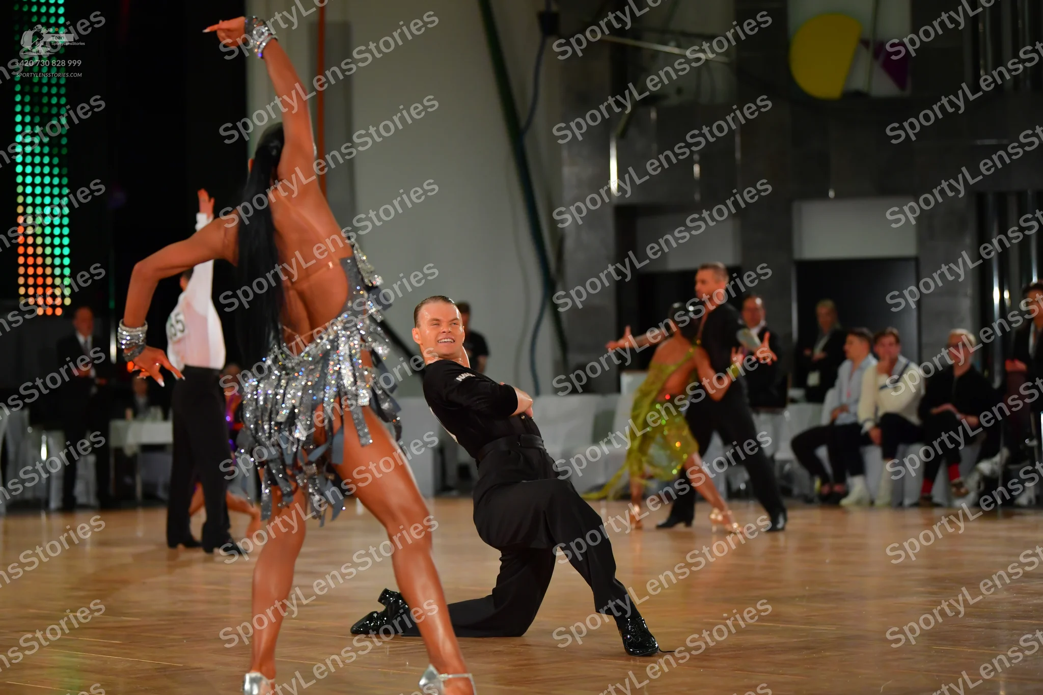 Dancesport competitor: Main female dancer: silver/grey Latin dress with long fringe