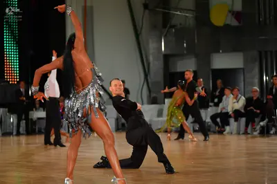 Dancesport competitor: Main female dancer: silver/grey Latin dress with long fringe