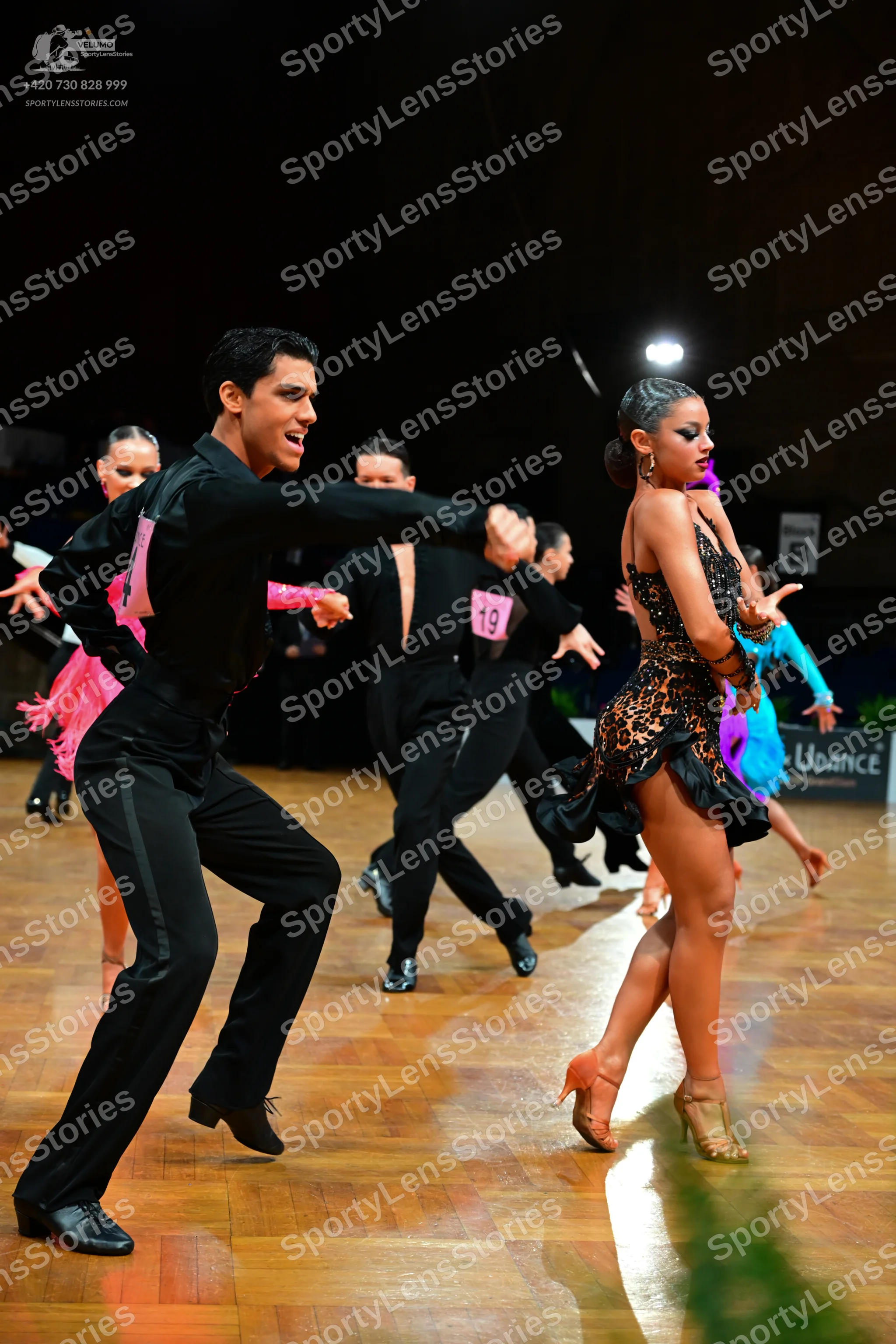 Dancesport competitor #19: Male dancers: black long-sleeve shirts and black trousers