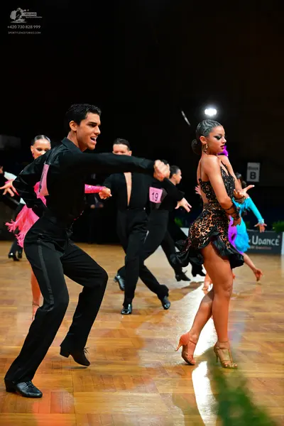 Dancesport competitor #19: Male dancers: black long-sleeve shirts and black trousers