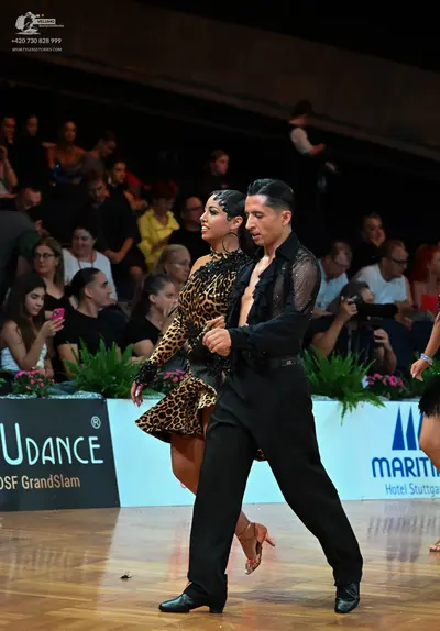 Dancesport competitor: Female dancer: leopard print latin dress with long sleeves