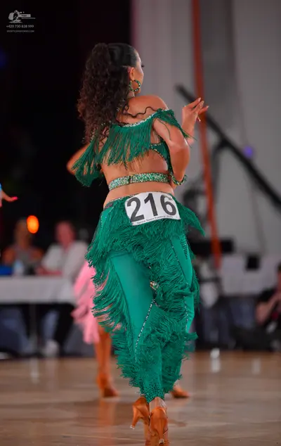 Dancesport competitor #216: Female dancer: green latin dance costume with fringe and sequins