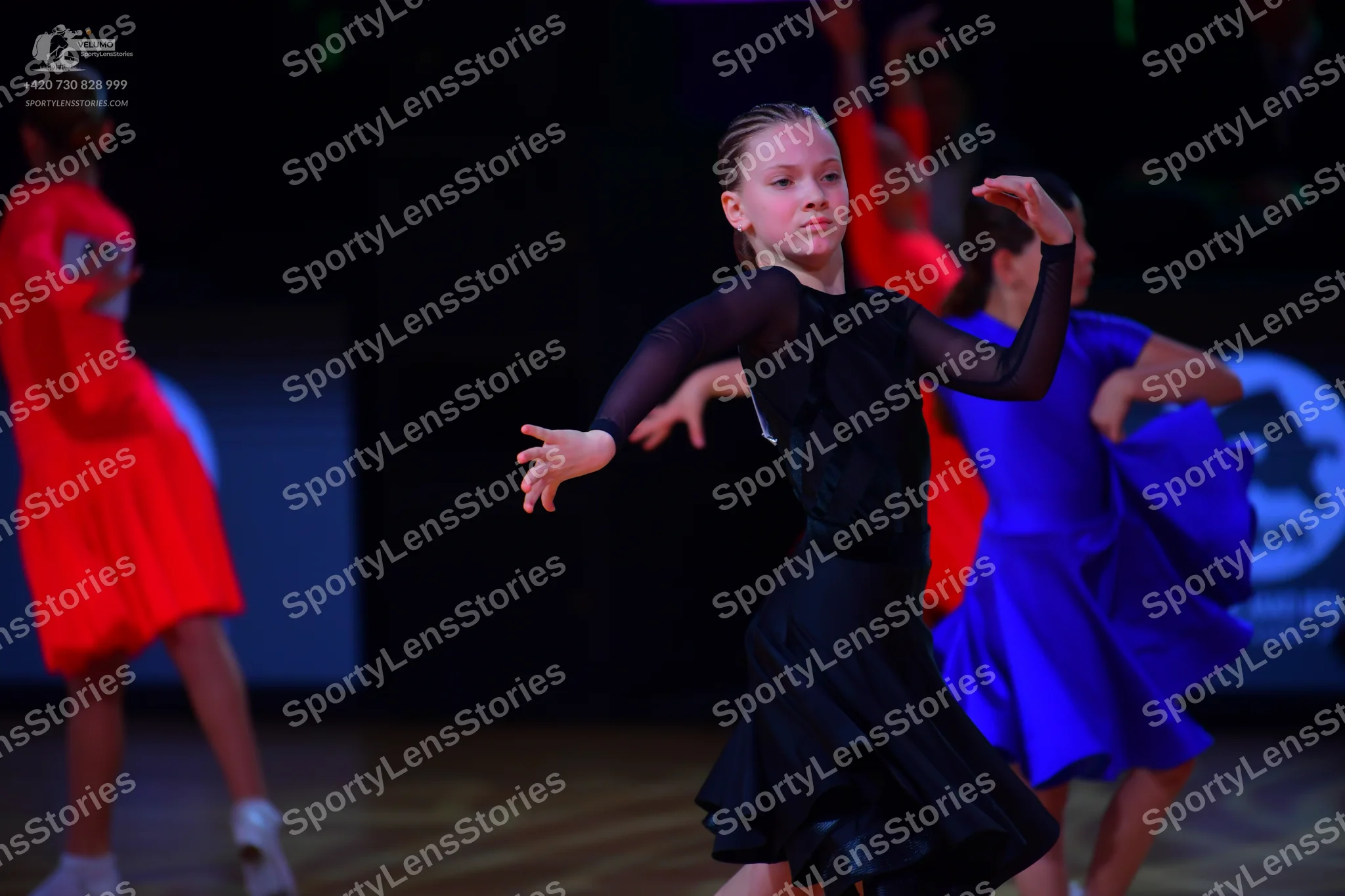 Dancesport competitor: Female dancer: red latin dress