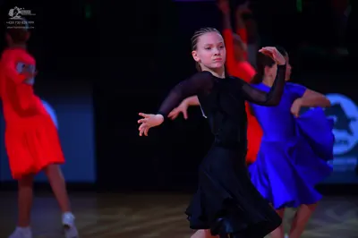 Dancesport competitor: Female dancer: red latin dress