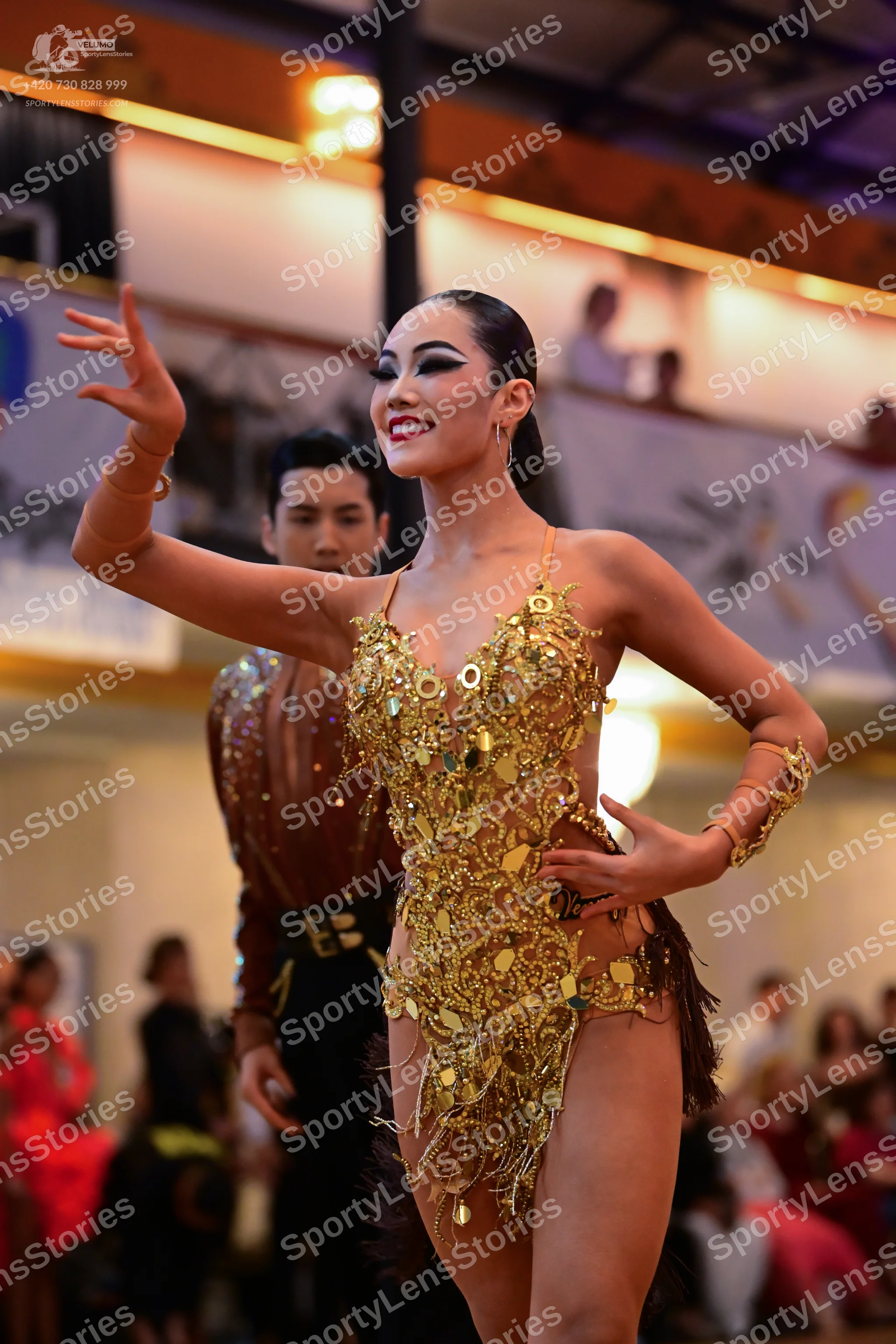 Dancesport competitor: Male dancer: bronze-colored shirt with a black waistband and black trousers