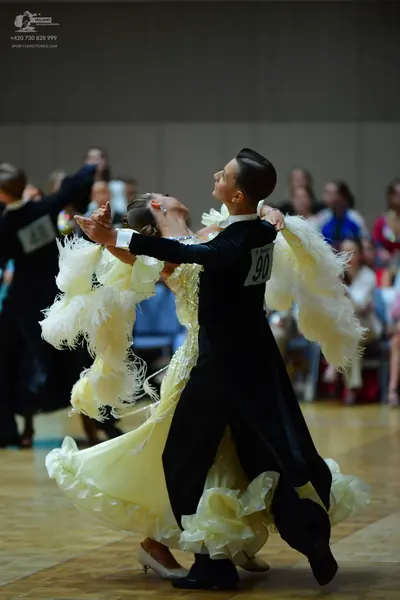 Dancesport competitor #90: Male dancer: black suit with white shirt