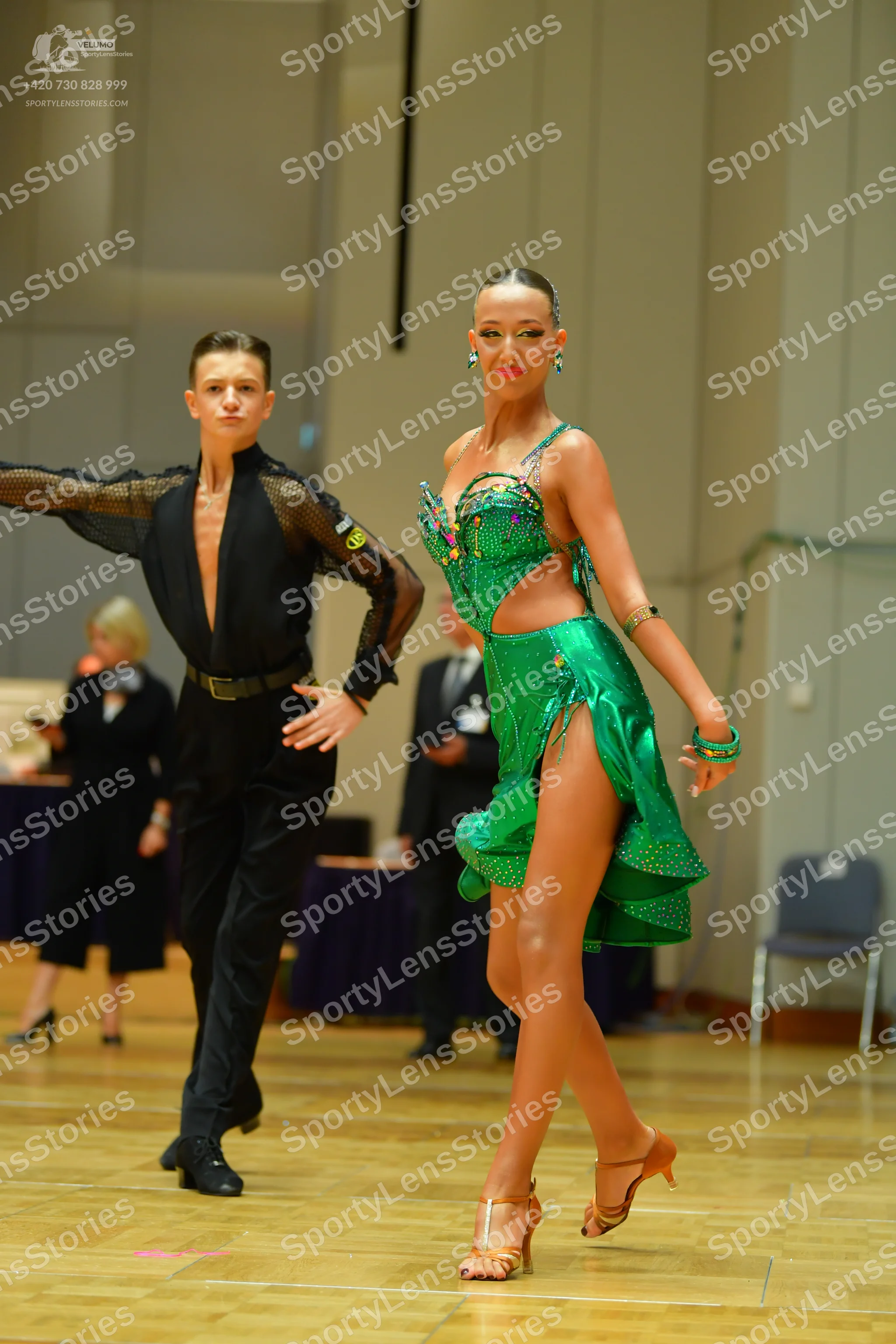 Dancesport competitor: Male dancer: black semi-transparent long-sleeved shirt with sequins on the sleev