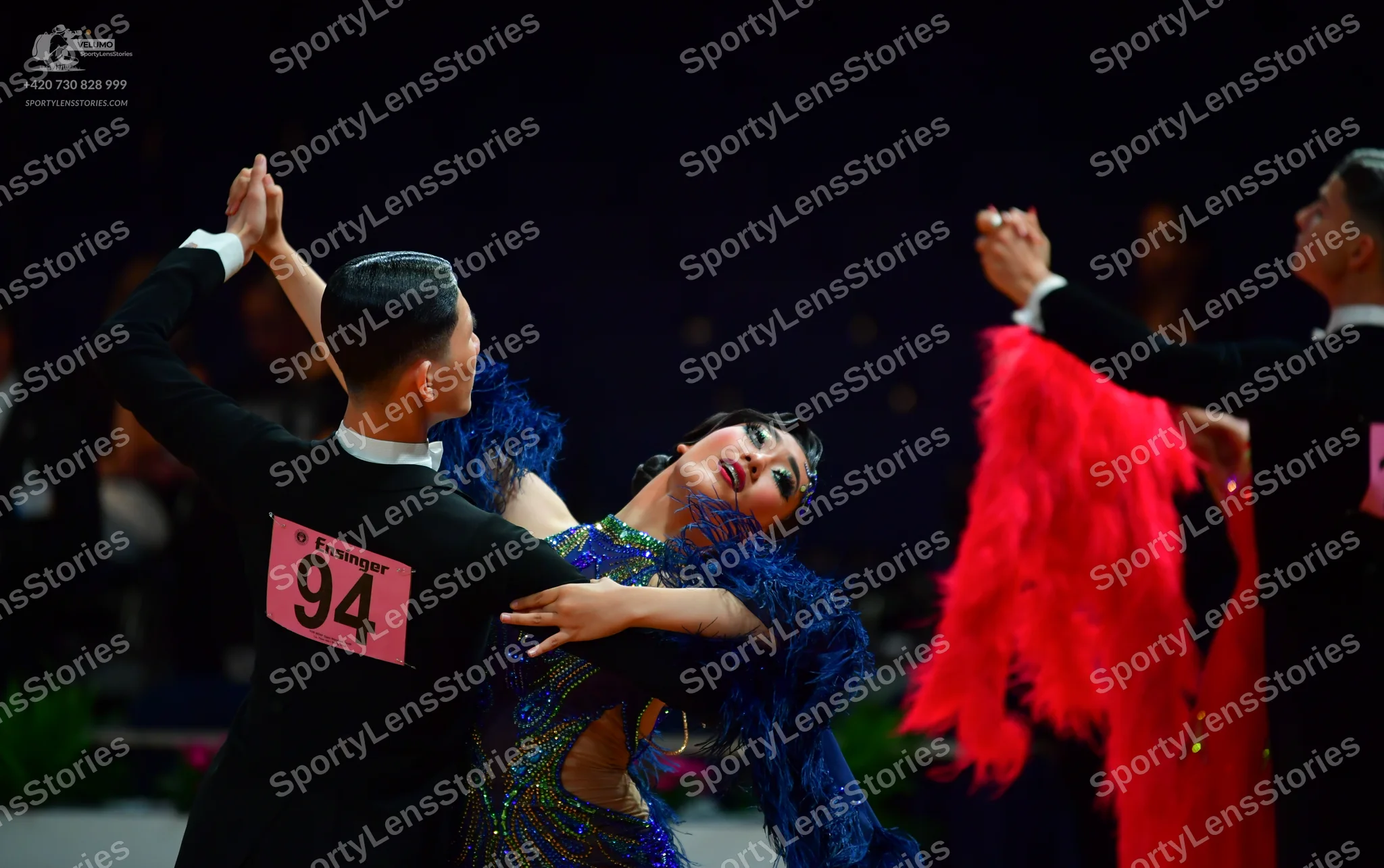 Dancesport competitor: Male dancer (left): black long-sleeved shirt with a white collar