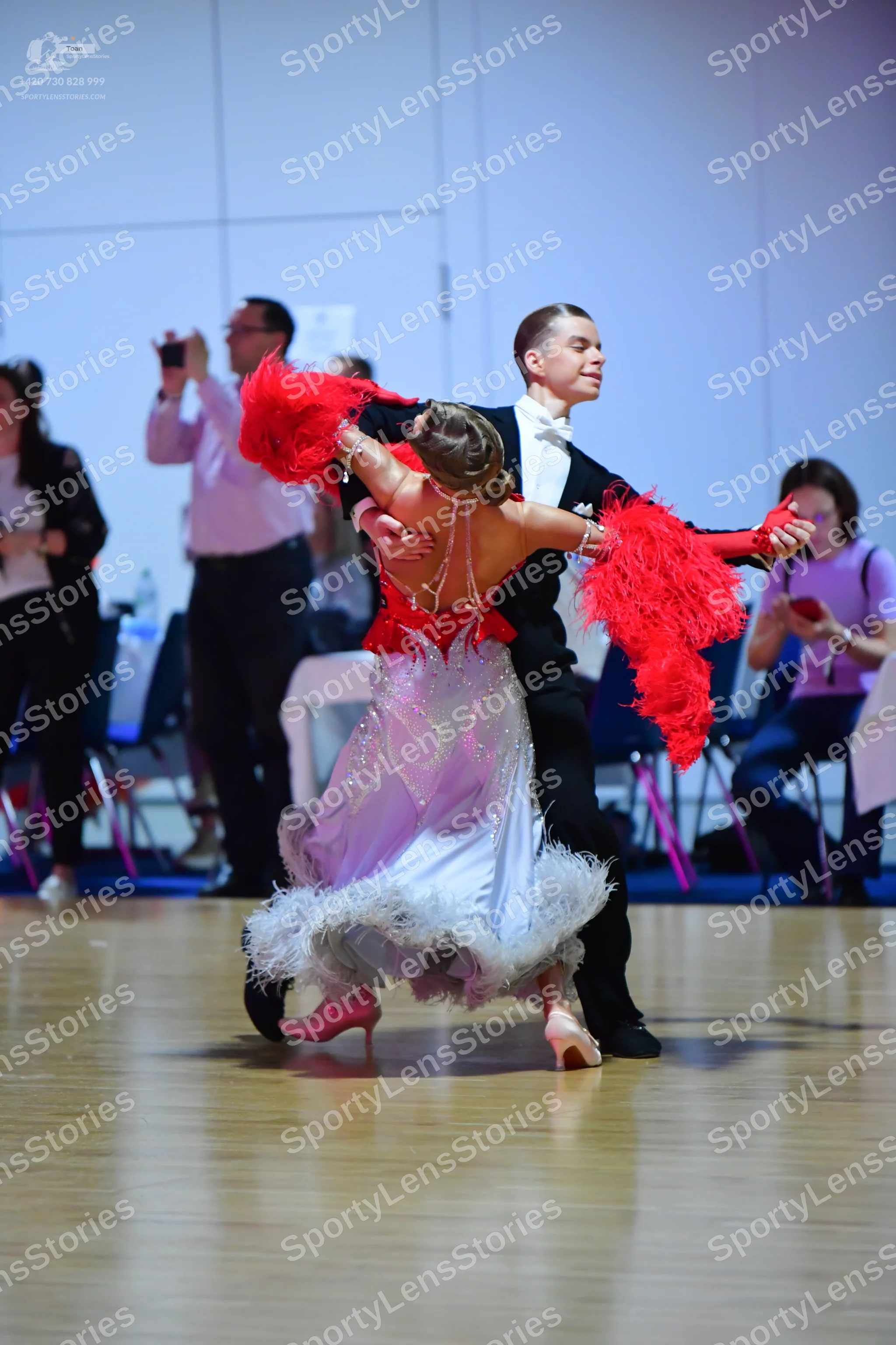 Dancesport competitor: Male dancer: black suit with a white shirt and black bow tie