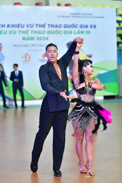 Dancesport competitor: ** Black suit with sequin lapels