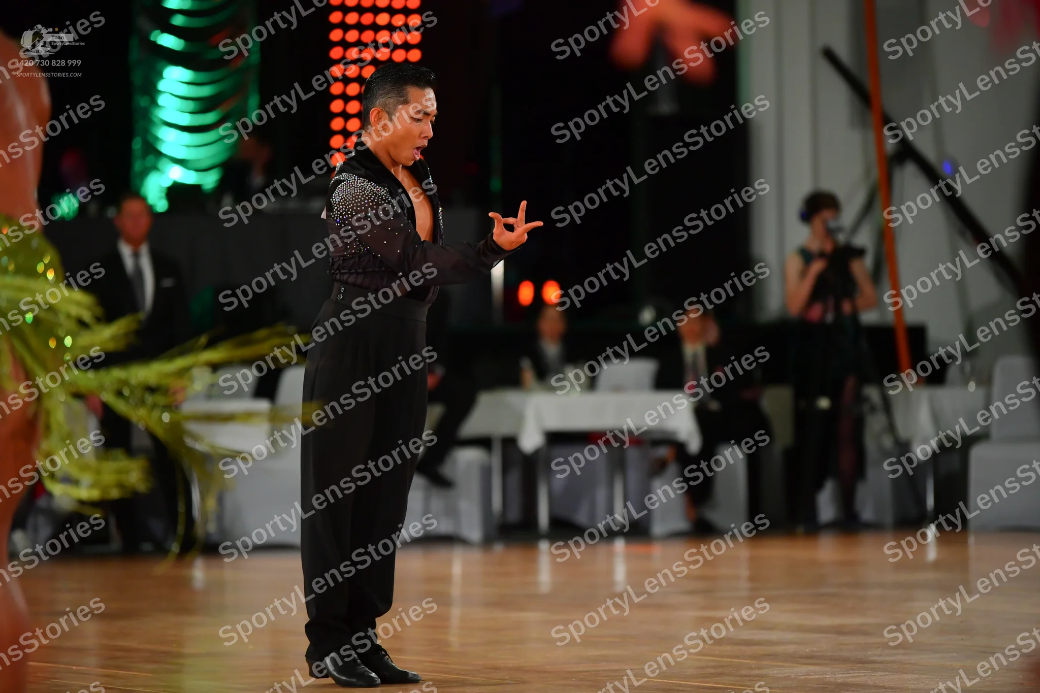 Dancesport competitor: Male dancer: black long-sleeved shirt with subtle shimmer or fine sequins and bl