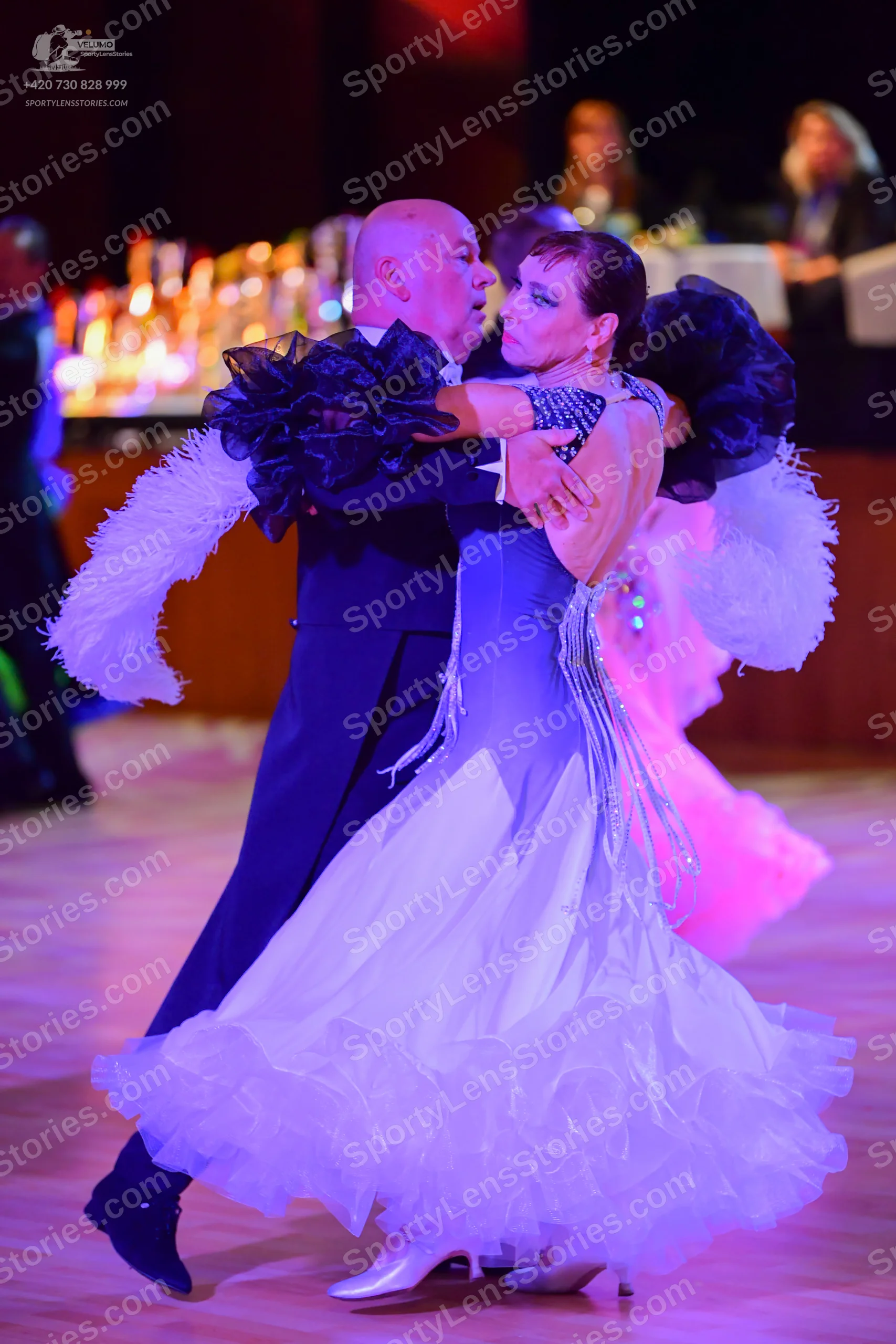 Dancesport competitor: Male:** Black tail suit with a dramatic, flowing tail