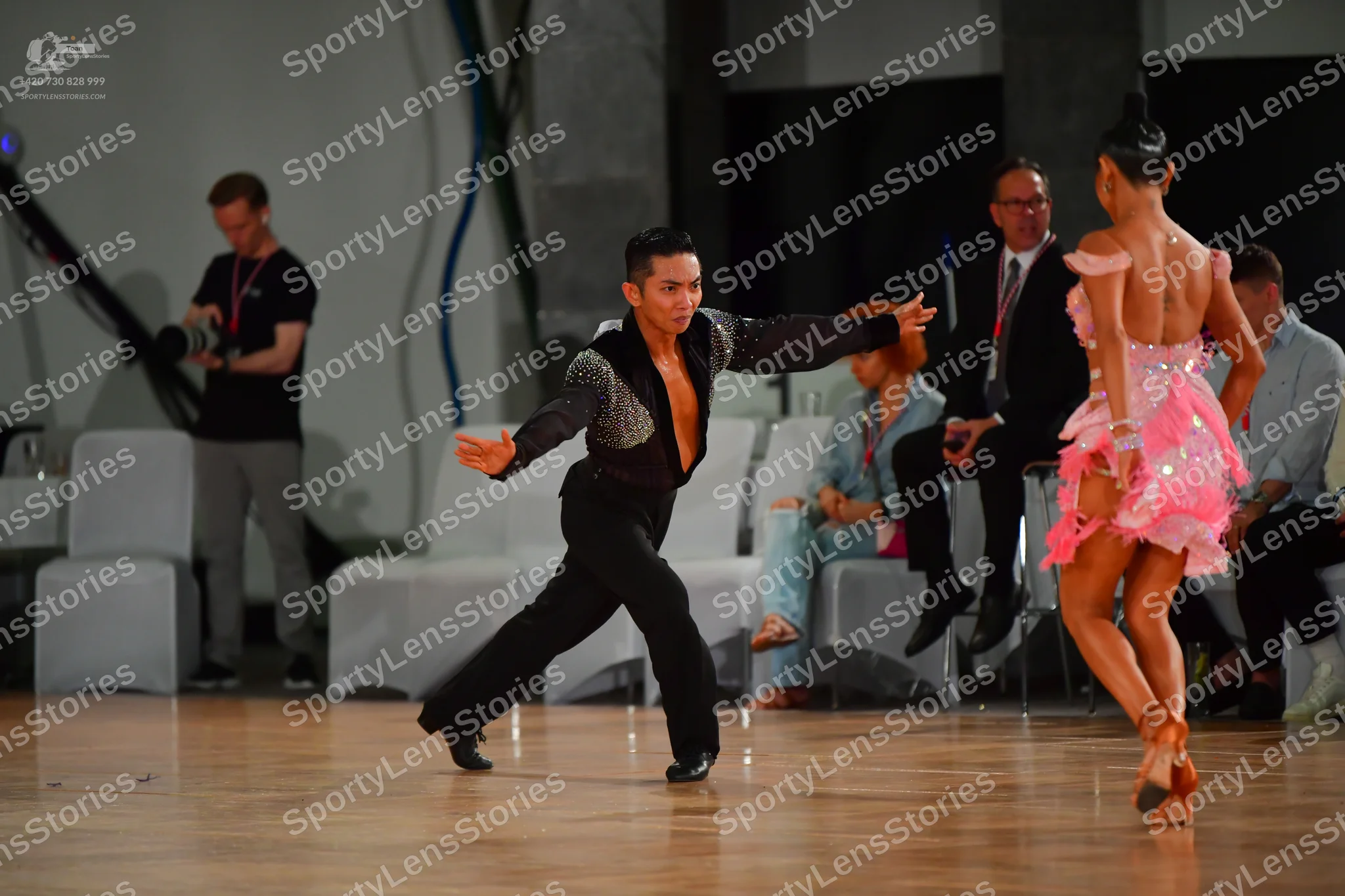 Dancesport competitor: Male dancer: black long-sleeved Latin dance shirt with a large sequined panel on